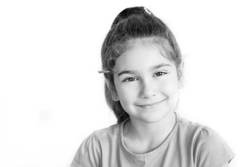 Portrait of happy laughing child girl. Smiling kid. Positive emotions. Black and white image