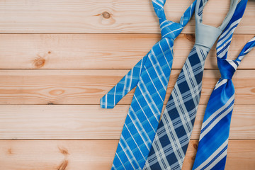 accessories for men. colorful ties on a wooden background. concept of happy father's day or shoppig