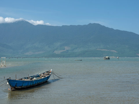 Growing oyster on car tires over poles in Vietnam