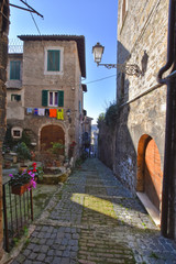 Anagni, Italy, A narrow street between the old stone houses of a medieval village.