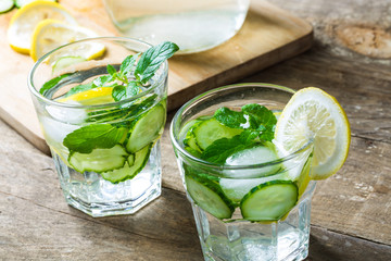 Detox water with lemon and cucumbers. Fresh water with lemon, mint and cucumber