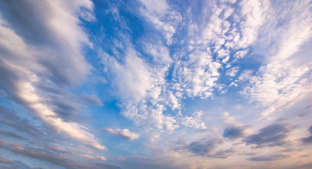 Naklejka na ściany i meble Beautiful blue sky and white fluffy clouds, Vibrant color sky with cloud on a sunny day, The morning sky with clouds in various shapes, Beautiful natural cirrus cloud background.