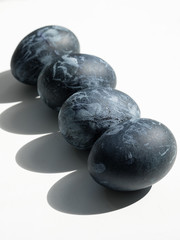 Background with easter eggs. Naturally dyed eggs prepared for Easter on white background. Happy Easter card. 