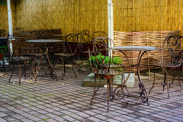 Chairs and tables in a cozy street cafe