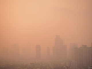 Fototapeta na wymiar Cityscape of Bangkok covered by mixture of dust in air pollution, situation of air pollution 2.5 pm in Bangkok, Air pollution in big city, it is unhealthy.