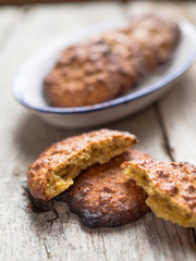 Close-up of freshly baked homemade cookies on an antique wooden table