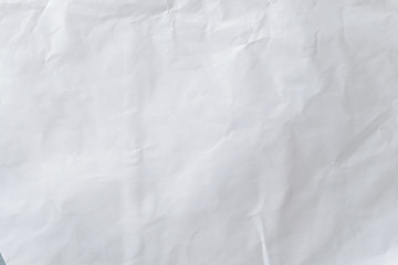 White crumpled paper pattern and texture for background. White creased paper background.