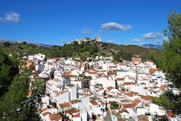 General view of the town with the castle on the hilltop, Monda, Spain.