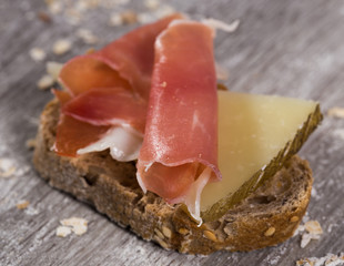 sandwich made with rye bread cheese and Parma ham