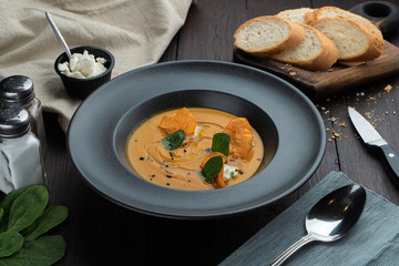 Seasonal creamy pumpkin soup, served with wheat bread, cheese and croutons
