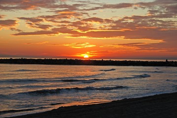 View along the shoreline towards Marbella at sunset, Spain.