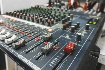 Close-up of professional concert mixing console, equipment for sound mixer control