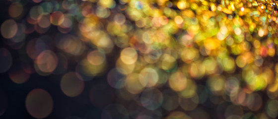 Abstract golden and black background with bokeh effect