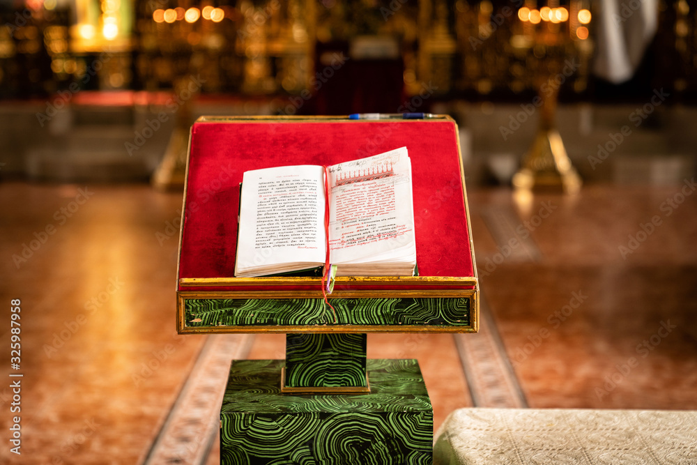 Wall mural book of prayers on table, wedding in church.