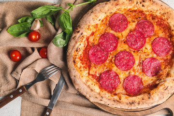 Board with tasty pizza on table