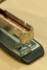 open stapler on table