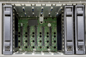 Storage area networking, cluster of raid hard drives. Close-up rack-mounted without disk array server