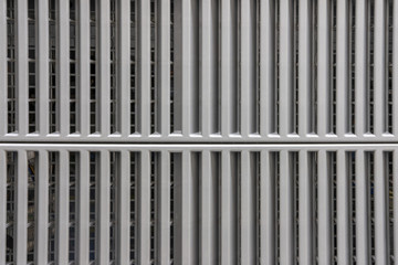 Grey metal surface with a two-part grid, background