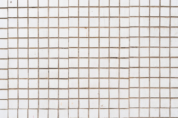 Texture of a wall covered with tiles, stock photo.