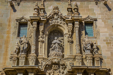 Fototapeta na wymiar Gothic Basilica de Santa Maria - most important sacred buildings in Alicante old town. Basilica was built in Valencian Gothic style between XIV - XVI centuries over remains of mosque. Alicante Spain.