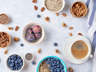 Healthy breakfast of superfoods, quinoa, honey, nuts, figs, coffee. Top view