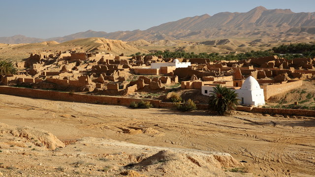The ruins of the abandoned village of Tamerza near Nefta, Tunisia, with a desert landscape