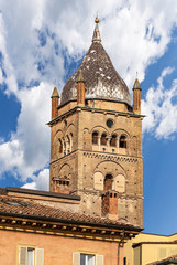 Fototapeta na wymiar Closeup of the ancient bell tower (1184-1426) of the Metropolitan Cathedral of San Pietro (Saint Peter the apostle). Bologna, Emilia-Romagna, Italy, Europe