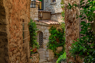 Old buildings on narrow streets in the medieval city of Eze Village in the South of France along the Mediterranean Sea