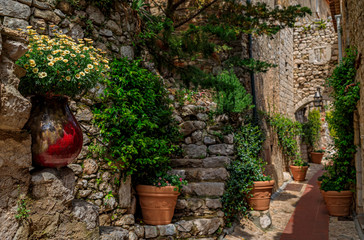 Old buildings on narrow streets in the medieval city of Eze Village in the South of France along the Mediterranean Sea