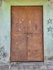 Old brown colour iron door of Assam government school