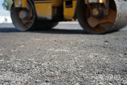 Blurred images of road roller maintenance work