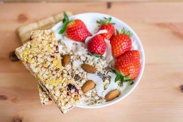 Healthy Breakfast with Muesli with Strawberries and Granola Bars