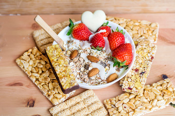 Healthy Breakfast with Muesli with Strawberries and Granola Bars