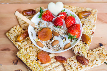 Healthy Breakfast with Muesli with Strawberries and Granola Bars