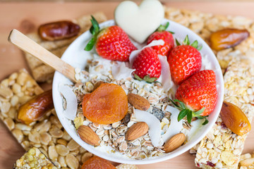 Healthy Breakfast with Muesli with Strawberries and Granola Bars