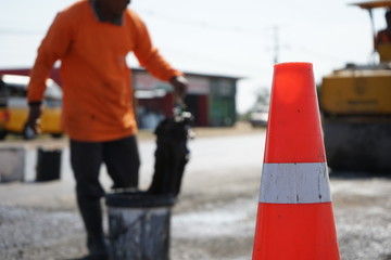 Red rubber cone in road construction And background blur