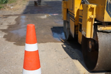 Red rubber cone in road construction And background blur
