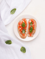 Bruschetta vegan sandwich with vegetables on a white background