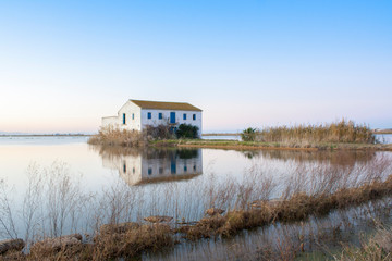 house in the middle of the rice fields of the albufera of valencia