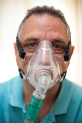 older man with oxygen mask