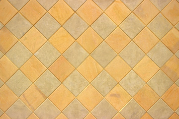 Fototapeta premium Gray-brown masonry in the form of a rhombus