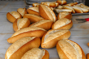 a large amount of freshly baked bread in the bakery,