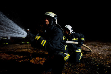 Fire brigade in action at night time