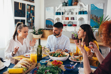 family gathering at home. vegan dinner party