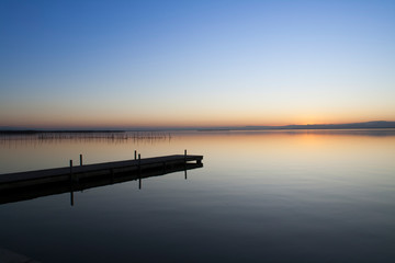 Fototapeta na wymiar jetty of saler lake at sunset, in the lagoon