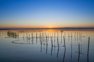 jetty of saler lake at sunset, in the lagoon