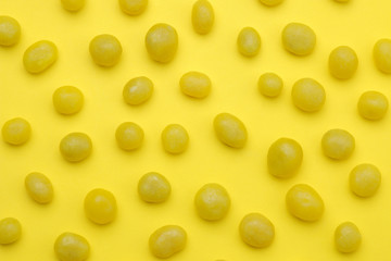 The concept of minimalism. background of delicious bright yellow sweets on a bright yellow background. top view.
