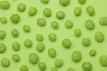 The concept of minimalism. background of delicious bright green sweets on a bright green background. top view.