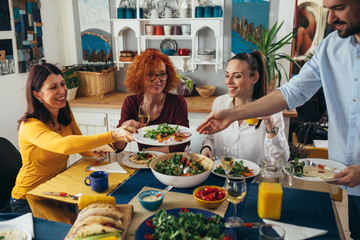 family gathering at home. vegan dinner party