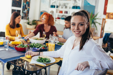 family gathering at home. vegan dinner party
